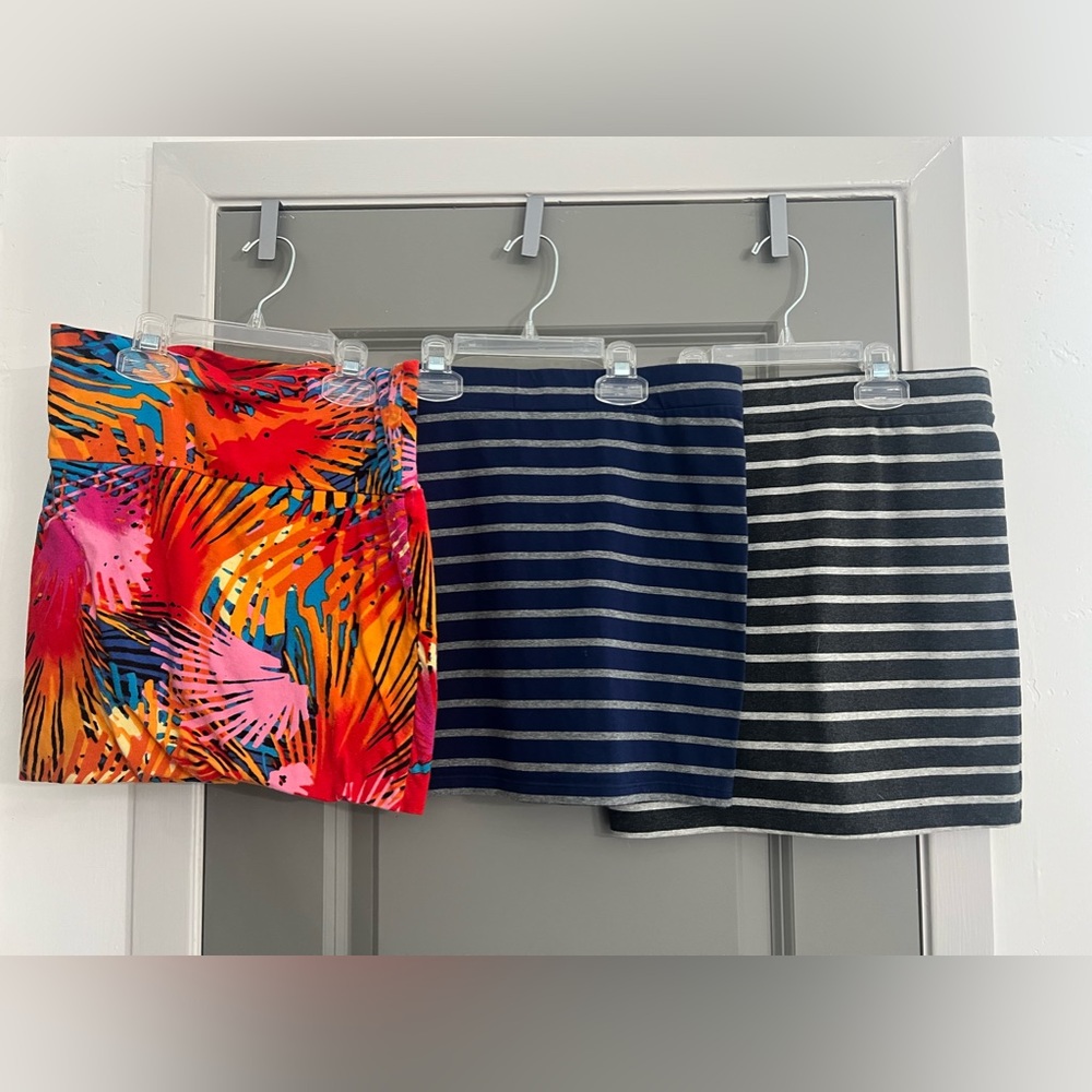 Set of THREE SKIRTS. Stretch. Sold as is. Staple wardrobe pieces. Can be coverup